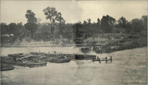 Known as "Bailey's Dam" for the Union officer who ordered its construction, Lt. Col. Joseph Bailey, this timber dam built by the Union Army on the Red River in Alexandria, Louisiana in May 1864 was designed to facilitate passage of Union gunboats to and from the Mississippi River. Photo: Public domain.